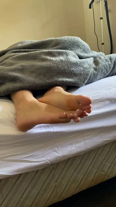 Soles teasing in bed in need of cum