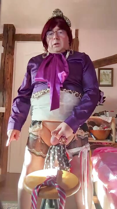 In an outfit with a little leopard skirt to ejaculate on the red tie