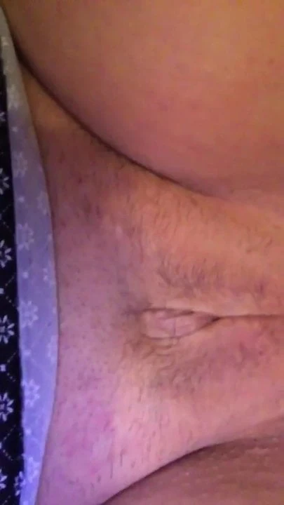 Mature plays with her shaved pussy