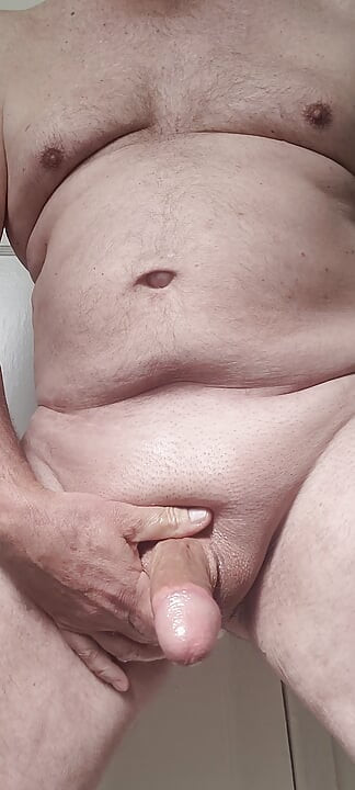 Solosexual strokes my shaved, oiled up cock to get a load of cum to swallow