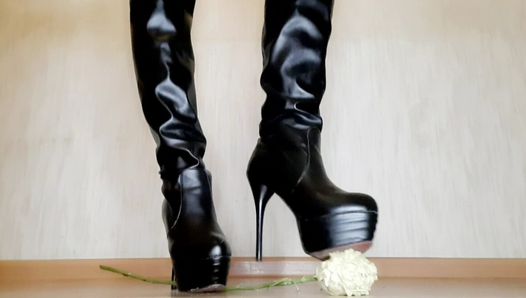 Dominatrix tramples roses with her beautiful shoes