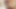 Long-haired Asian shemale in colorful bikini jerks off her