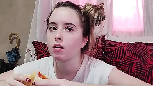 Eating an omelette sandwich with cherry tomatoes