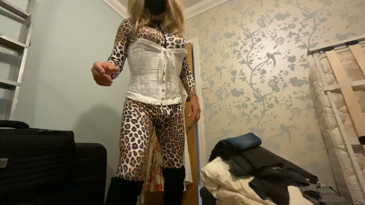 Mature CD Joanne posing in tight animal print bodysuit