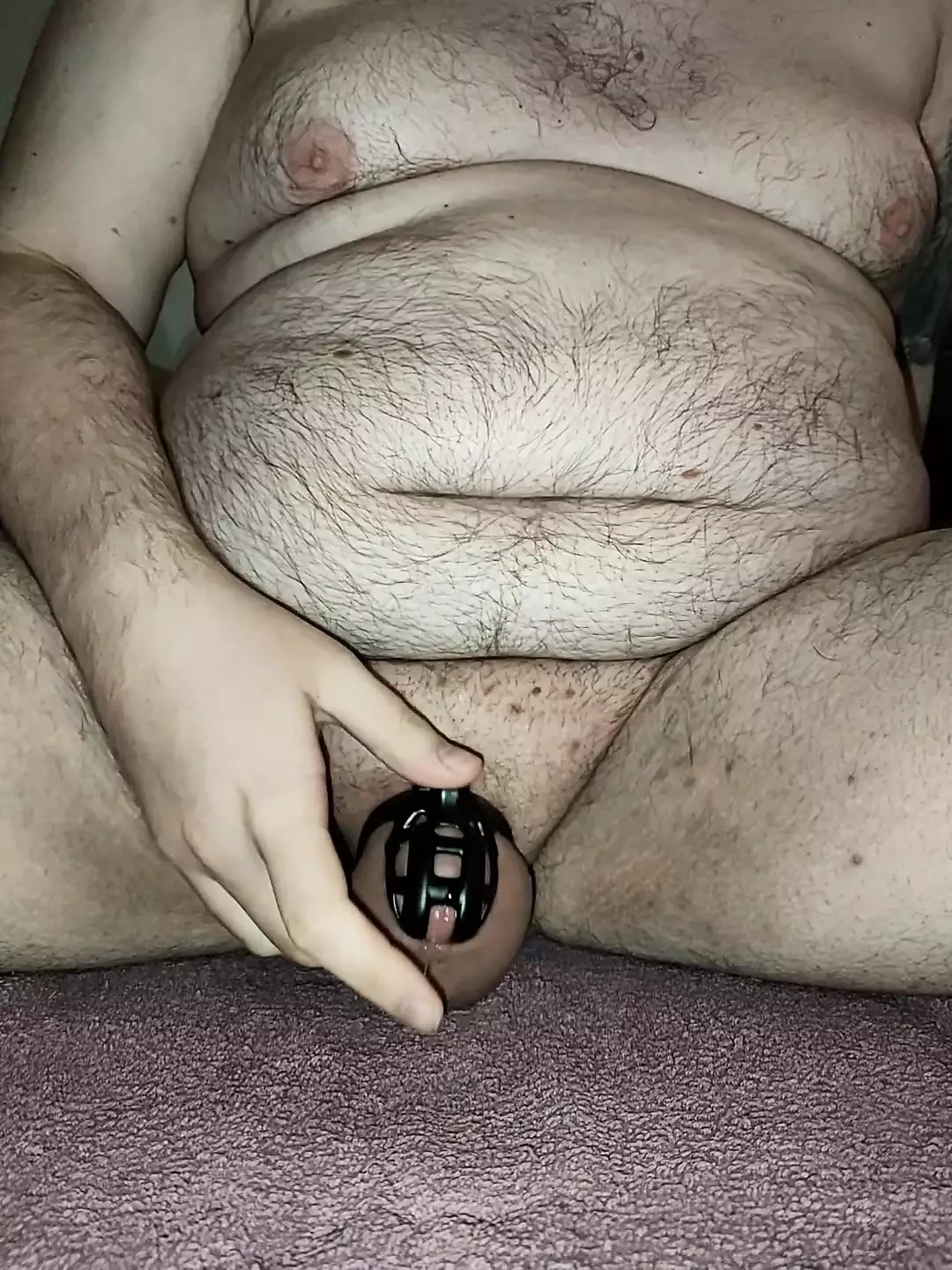 Hairy Bear Locked in Chastity Cums in Condom