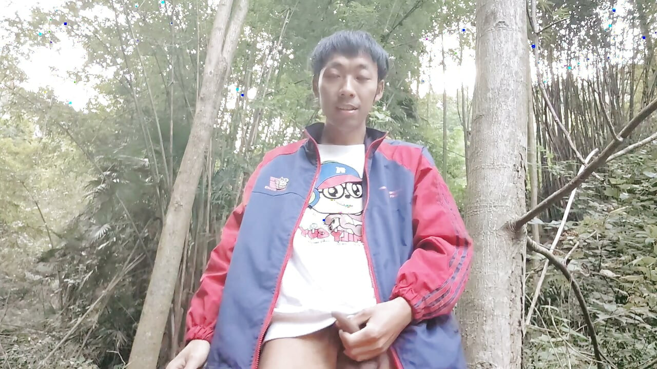 Asian male masturbates in the deep mountains and jungles, moaning and ejaculating, swallowing the liquid