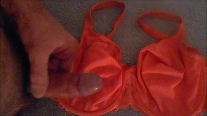 handjob & big cumshot on pink bra .