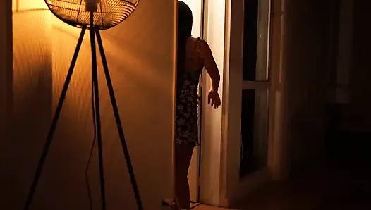 Sensual Latina Doing a Striptease in Low Light