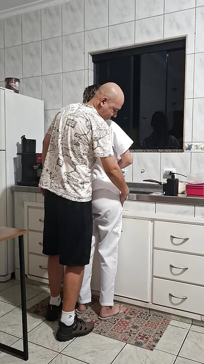 The maid got fucked in the ass in the kitchen while washing the dishes.