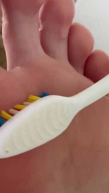 Tickling big feet with a toothbrush - do you want to tickle my legs? I love this