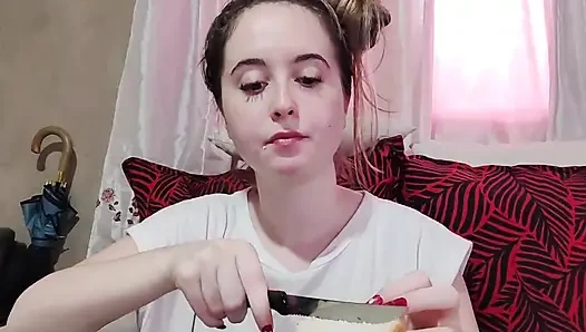Eating an omelette sandwich with cherry tomatoes
