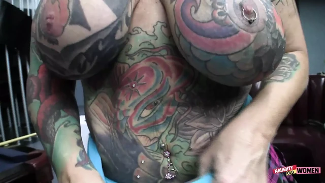 Busty tattooed slut gets fucked on the pool table by a massive black cock