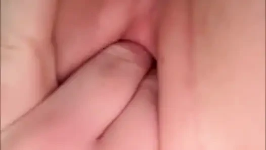 Cute girl pisses in a bottle and pours it back into her pussy