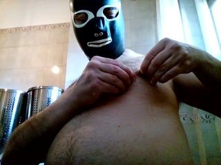 Kocalos - I wear a latex mask and pierce a nipple