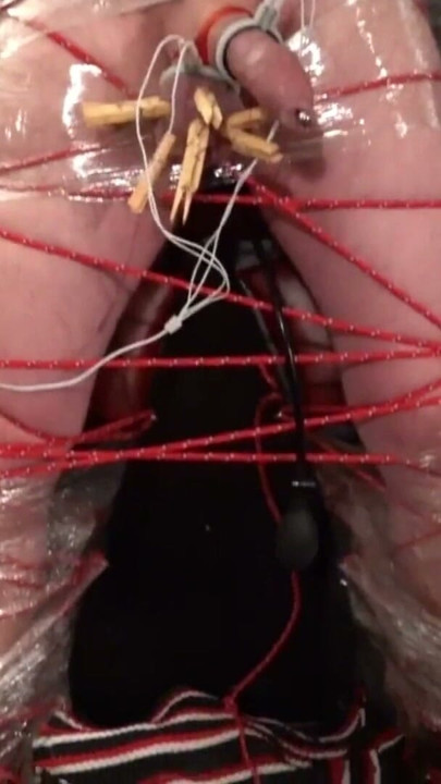Frankenslave is suspended in cling film bondage with electro play in the dungeon of Lady Diva Cane | Clip 1
