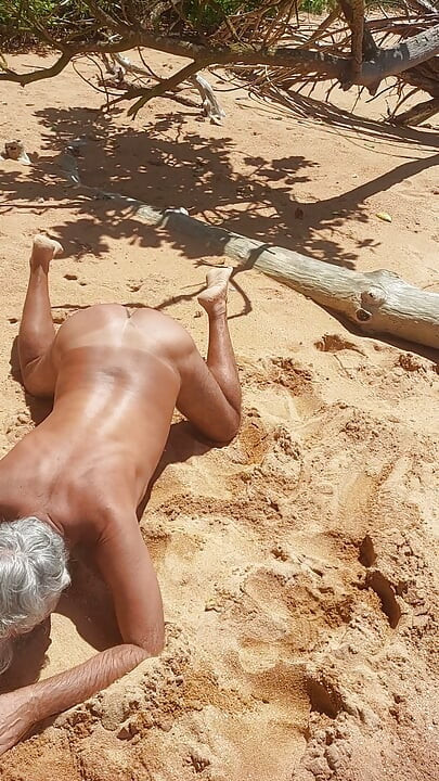 Ladysilva on the beach naked on all fours showing off her big sexy tanned ass
