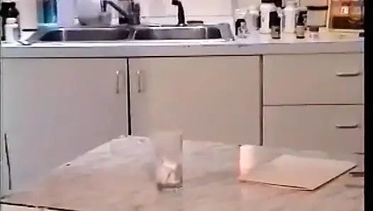 Lusty brunnette and hefty male suck one cock on kitchen cabinet