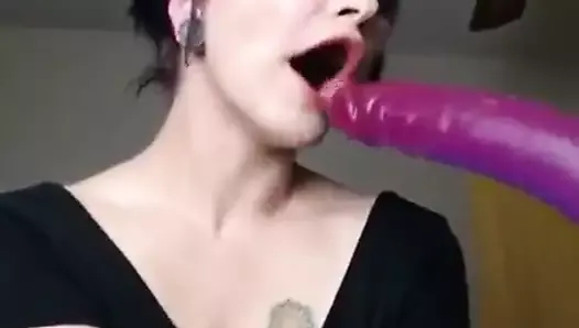 Woman swallows a huge Dildo completely