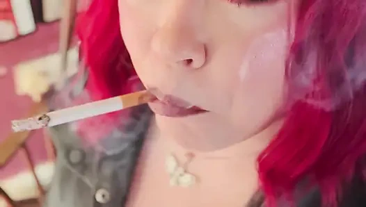 Your Mistress Tina Snua dressed In Leather Chain Smoking 2 Cork Cigarettes