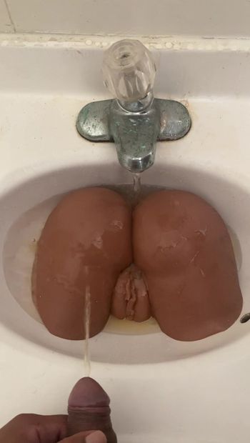 Pissing on a doll