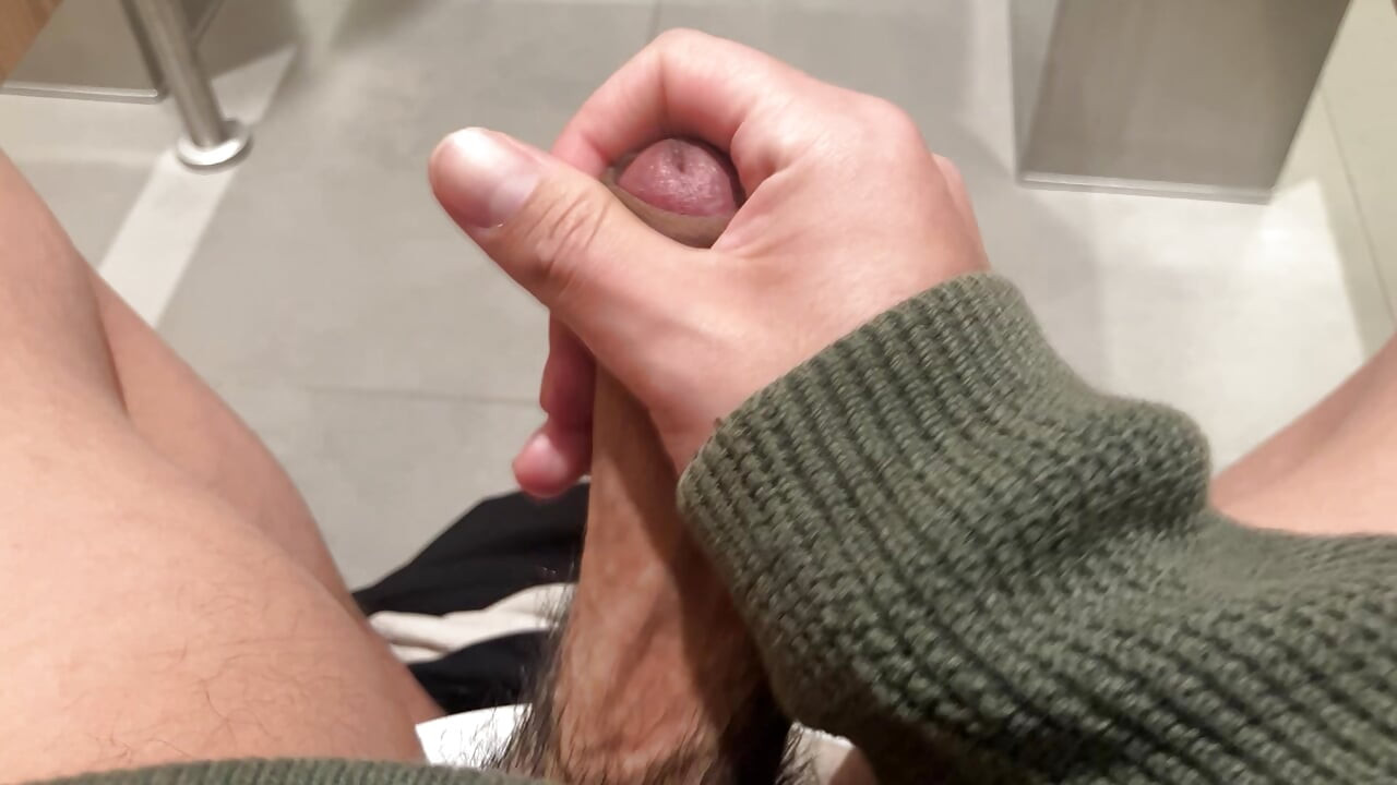 jerking off at the airport's restroom