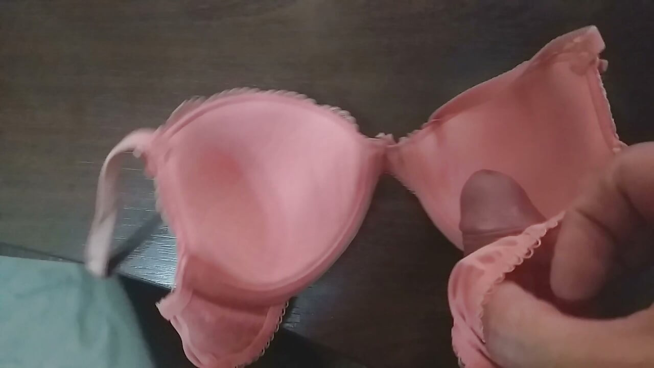 Playing with a coral bra