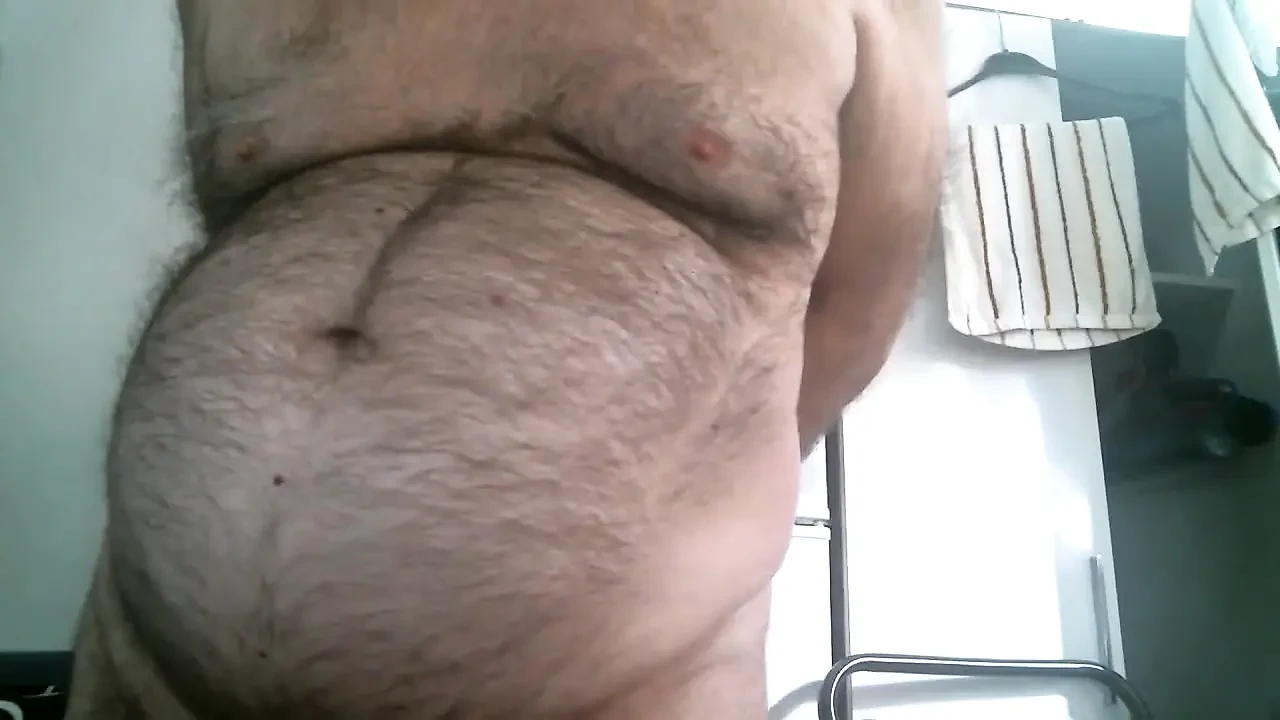 Coach Karl Shows off His Furry Belly