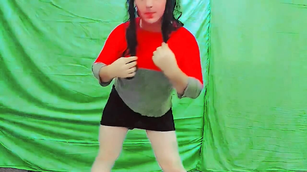 Cute femboy lifting skirt slightly under soft lights