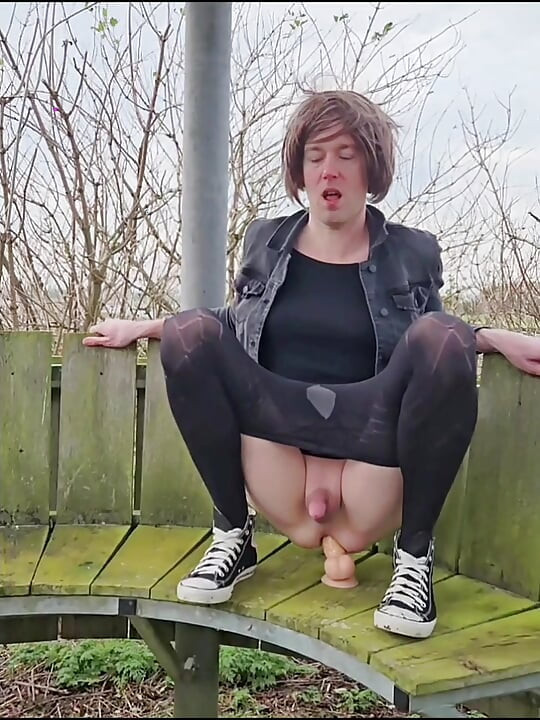 Riding dildo outdoor on bench