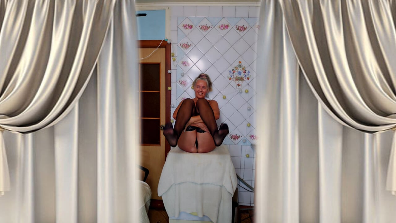 Hot housewife Lukerya flirts and changes clothes in the kitchen.