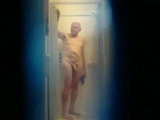 Well hung old man having a shower