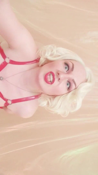 Captivating moment from "Strap-on POV video: topless Mistress in thigh high over knee boots with long gloves - Arya Grander"