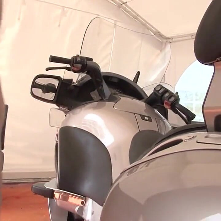 Horny brunette gets fucked on motorcycle