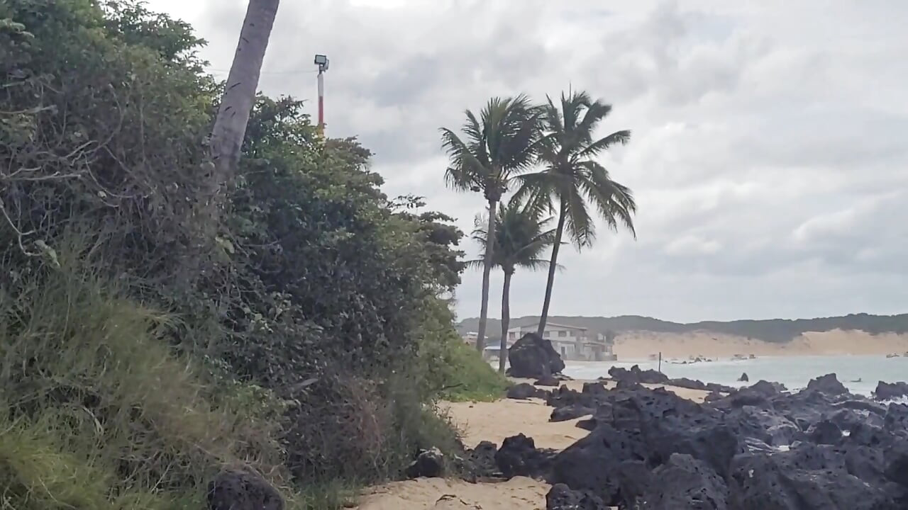 Beautiful Brazilian Making Out on the Beach with People Passing by