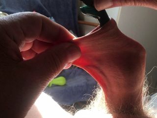 Three minutes of foreskin stretch in sunlight: pliers