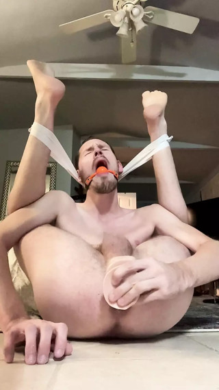 Pretzel faggot bounces on dildo and gapes hole
