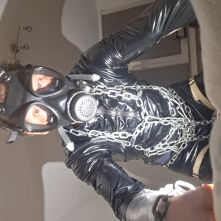 I'm already showing myself here in a tight vinyl dress and with a gas mask