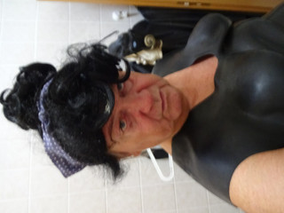perv rubber bessy ,ramming the black stick deeply ,wank on rubber boot ,swallows thumbnail