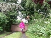 In fuchsia flight attendant outfit for an evening