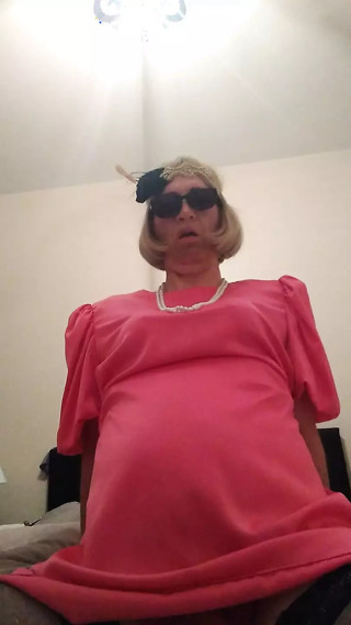 Cindy fucks dildo in pink dress thumbnail