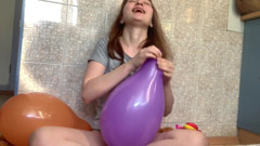 Naughty girl popping ballons