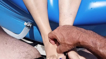 Pool side foot job in the back yard
