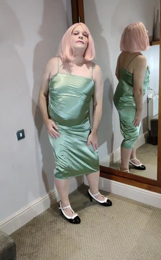Sexy green satin dress and heels.