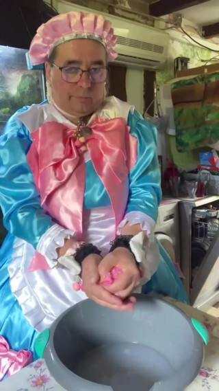 In a blue maid's outfit with pink bows to do the laundry. thumbnail