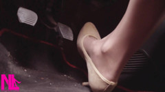 Driving Fast in Beige Pumps on Way to Airport