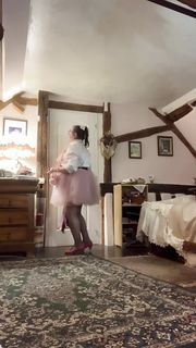 Wear a pink skirt or petticoat and a white blouse