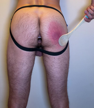 Self spanking with wooden spoon