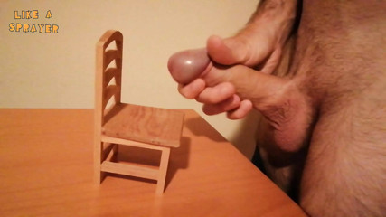 Handjob and cumshot on a small wooden chair