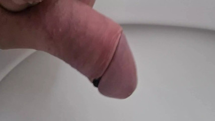Public toilet pissing and rubbing cock in toilet