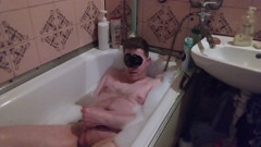 Guy with small cock masturbating in the bathtub and butt plug